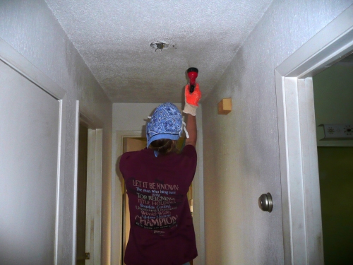 Vanessa spraying ceiling